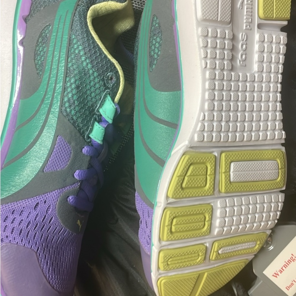 Puma big girls/women Purple and Green Athletic Sneakers size 4 but 6 in women’s.
